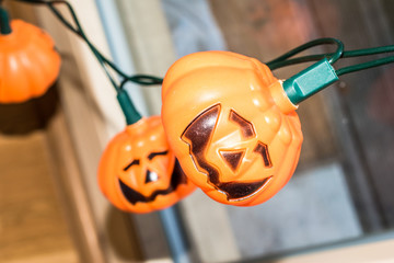 Hallowen holiday lights shaped like Jack O'Lantern pumpkin
