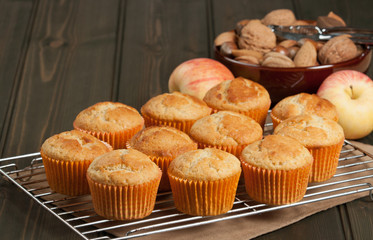 Homebaked Cupcakes In Paper Cases. Wooden Table. Apples. Nuts.