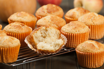Homebaked Cupcakes In Paper Cases. Wooden Table. Pumpkins. Apple