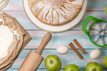 Apple pie on wooden background color, horizontal, soft focus