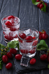 Cold summer drink with red berries