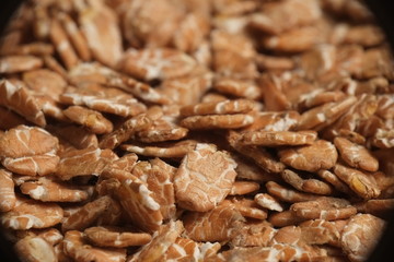 Overview photograph of oat flakes, rolled grains. Healthy lifestyles and nutrition