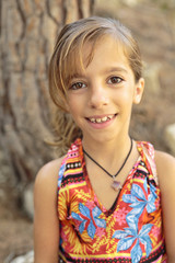 Portrait of girl next to a tree