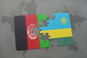 puzzle with the national flag of afghanistan and rwanda on a world map background.