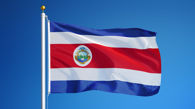 Costa Rica flag waving against clean blue sky, close up, isolated with clipping path mask alpha channel transparency