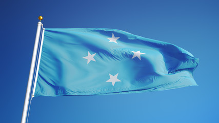 Federated States of Micronesia flag waving against clean blue sky, close up, isolated with clipping...