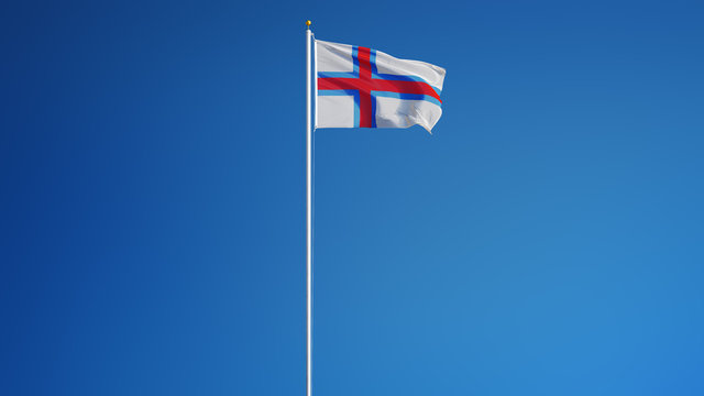Faroe Islands flag waving against clean blue sky, long shot isolated with clipping path mask alpha channel transparency digital composition