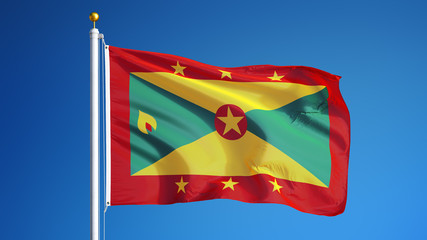 Grenada flag waving against clean blue sky, close up, isolated with clipping path mask alpha channel transparency