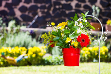 Flower pot in garden. Hand crafted ornaments for gardens.