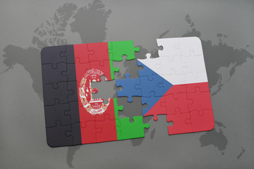 puzzle with the national flag of afghanistan and czech republic on a world map background.