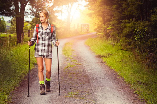 Woman Hiking On Road