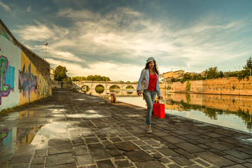 mature shopping along roman bridge