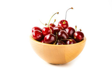 Cherry berries in wooden bowl