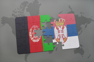 puzzle with the national flag of afghanistan and serbia on a world map background.