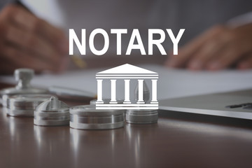 NOTARY. Metal ink pads and stamps on notary public table - obrazy, fototapety, plakaty