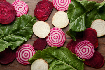 Fresh sliced beetroots with tops, closeup