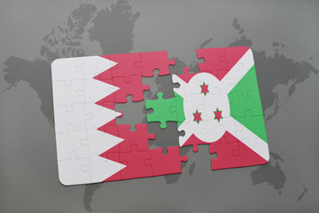 puzzle with the national flag of bahrain and burundi on a world map background.