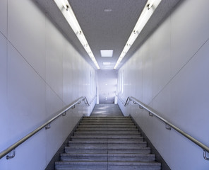 Passage way with stairs going underground in a subway
