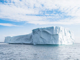 Fototapeta na wymiar Large iceberg in June run aground near St. Anthony's Newfoundland