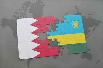 puzzle with the national flag of bahrain and rwanda on a world map background.