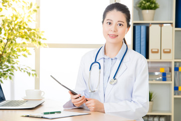 doctor using digital tablet to research patient's medical case