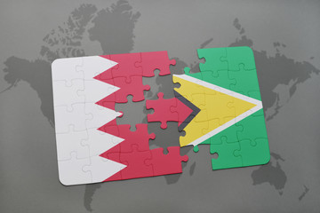 puzzle with the national flag of bahrain and guyana on a world map background.