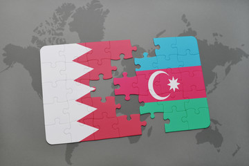 puzzle with the national flag of bahrain and azerbaijan on a world map background.