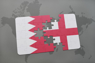 puzzle with the national flag of bahrain and england on a world map background.