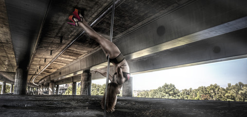 Female pole dancer performing outdoors