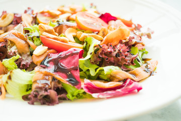 Tomato and vegetable salad with smoked salmon meat