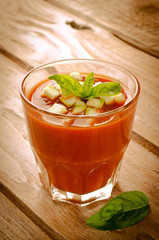 Tomato gazpacho in a glass with basil ang zucchini
