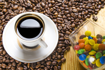 cup of coffee with candies