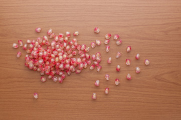 Ripe pomegranate fruit on wooden background