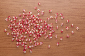 Ripe pomegranate fruit on wooden background