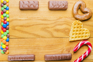 beautiful candies on a wooden background