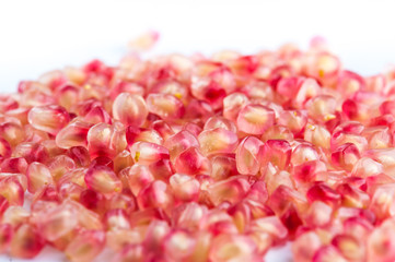 pomegranate and seeds on white background