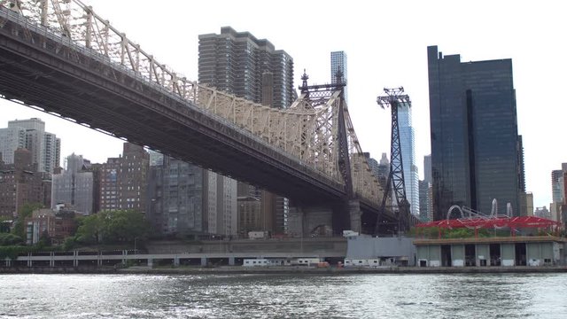 The Queensboro Bridge aka the 59th Street Bridge, officially titled the Ed Koch Queensboro Bridge, is a cantilever bridge over the East River in New York City that connects Queens with Manhattan