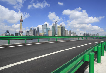 Empty road surface with shanghai bund city buildings