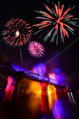 Colorful fireworks and celebration on the bridge. In a delightful festival, Kanchanaburi, Thailand