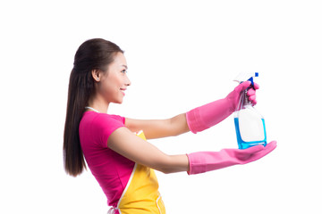 Portrait of a beautiful girl with a detergent for cleaning