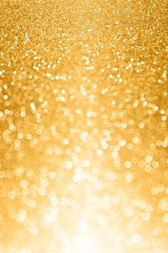 Glitzy gold glitter bokeh bling background or invite