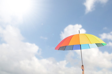 Holding colorful umbrella