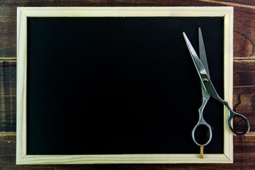 Blank blackboard and scissors hairdresser.Template mock up for a