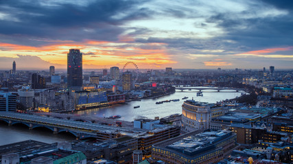 Skyline view of central London with famous landmarks, River Thames and skyscrapers at sunset -...