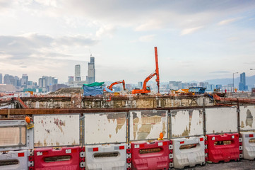 Fototapeta na wymiar selective focus Backhoe work in construction site in Hong Kong