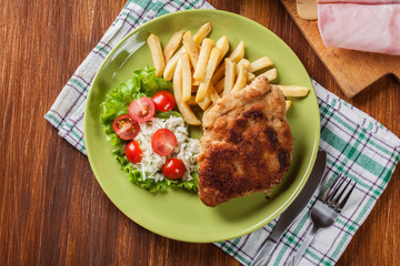 Cutlet Cordon Bleu with pork loin served with French fries and s