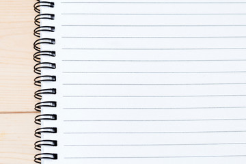 blank notebook on wooden table