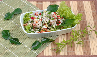 Spicy and sour mixed herb salad with crab  . Side view.