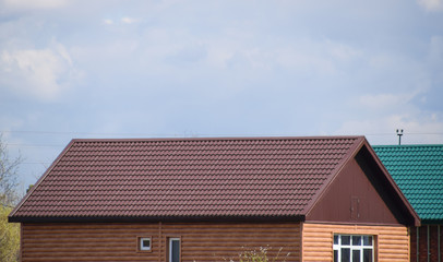 The roof of corrugated sheet on the houses