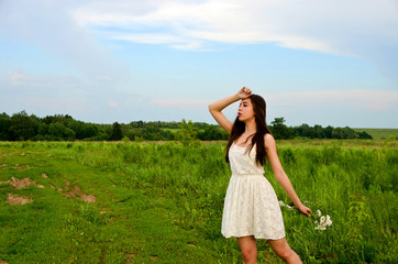 girl in a white dress with a flower